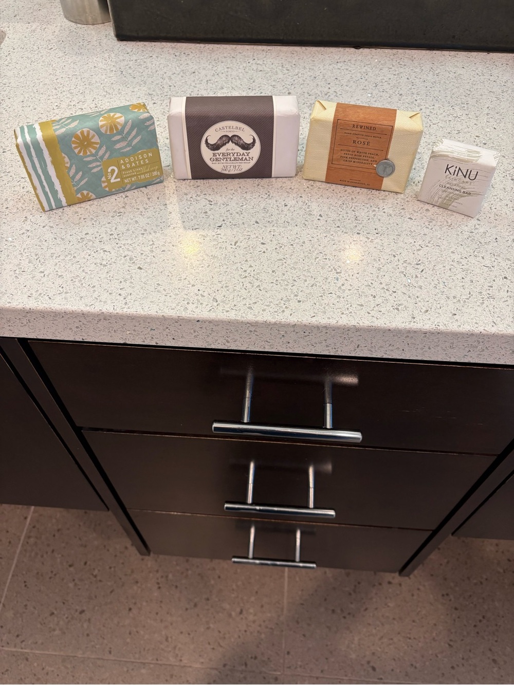 Collection of four assorted wrapped soaps
